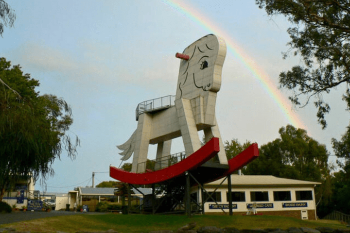 a bus parked in front of a tree