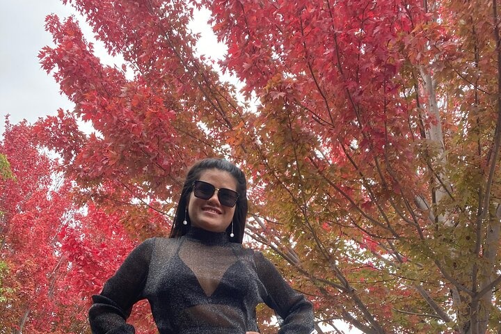 a person standing next to a tree