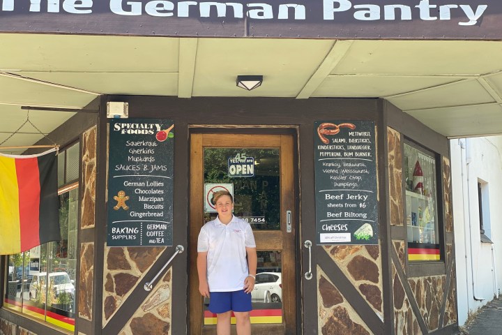 a man standing in front of a store