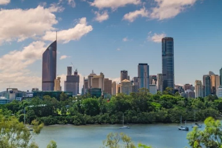 a large body of water with a city in the background