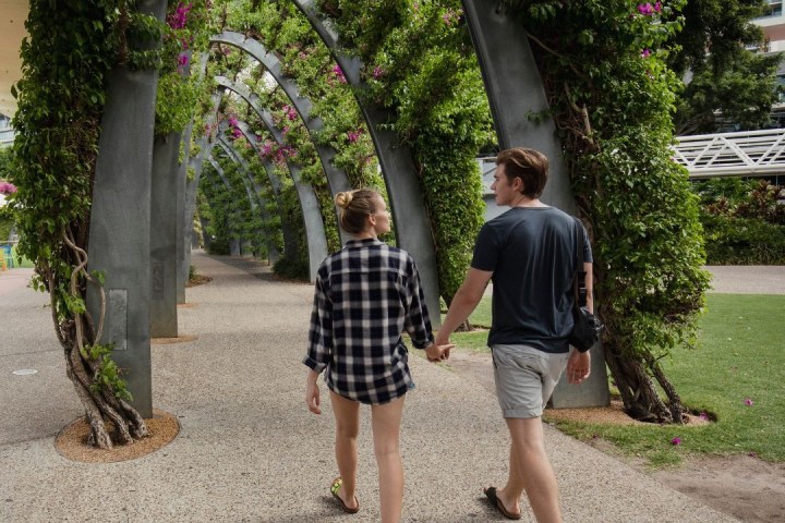 a man walking down a dirt road