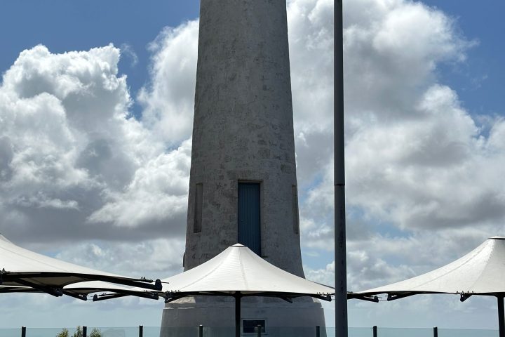 a building next to a body of water