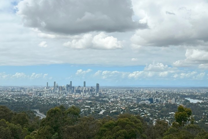 a large body of water with a city in the background