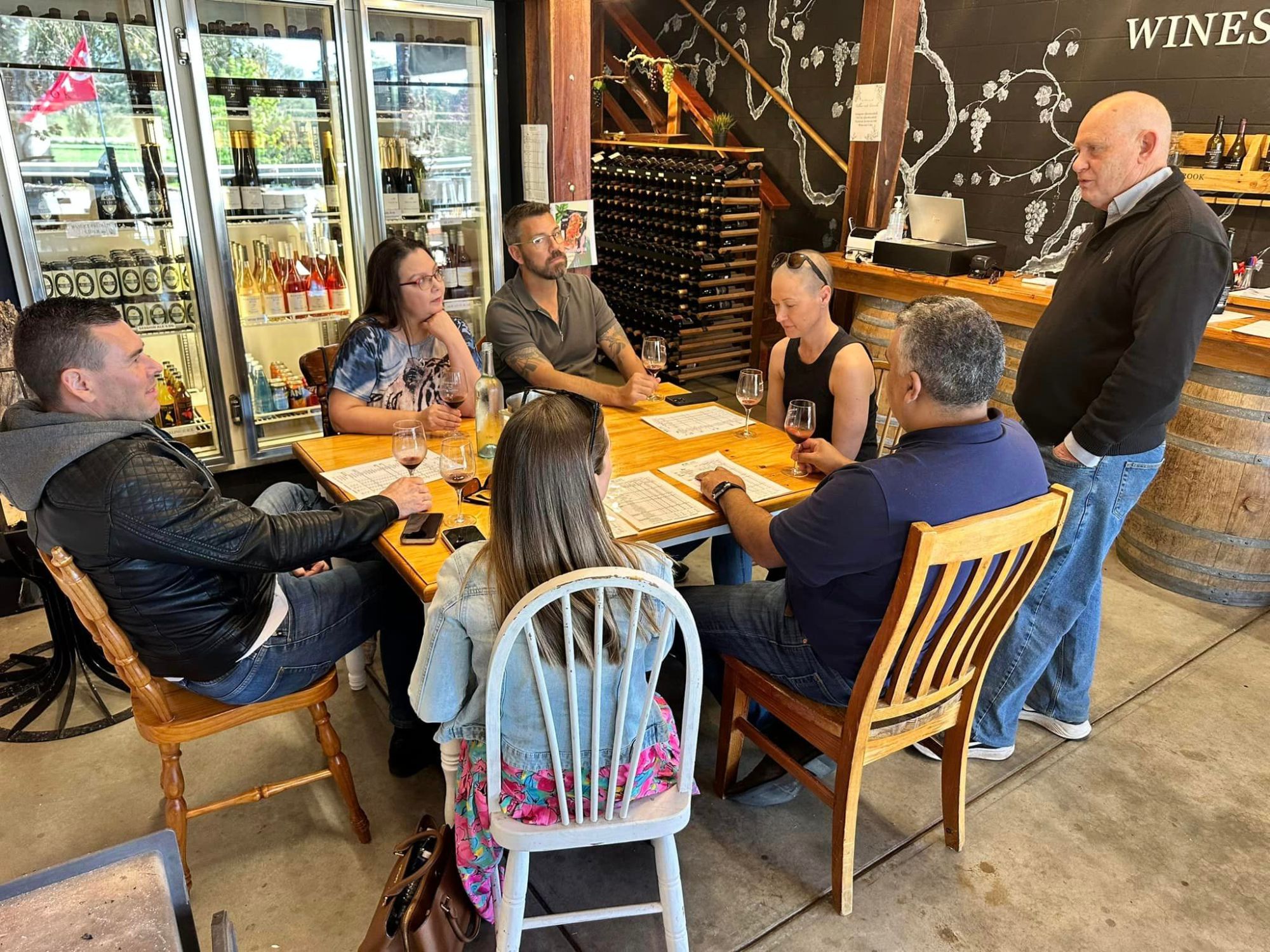 456411684_1065056618953246_3242880688541209957_n a group of people sitting at a table