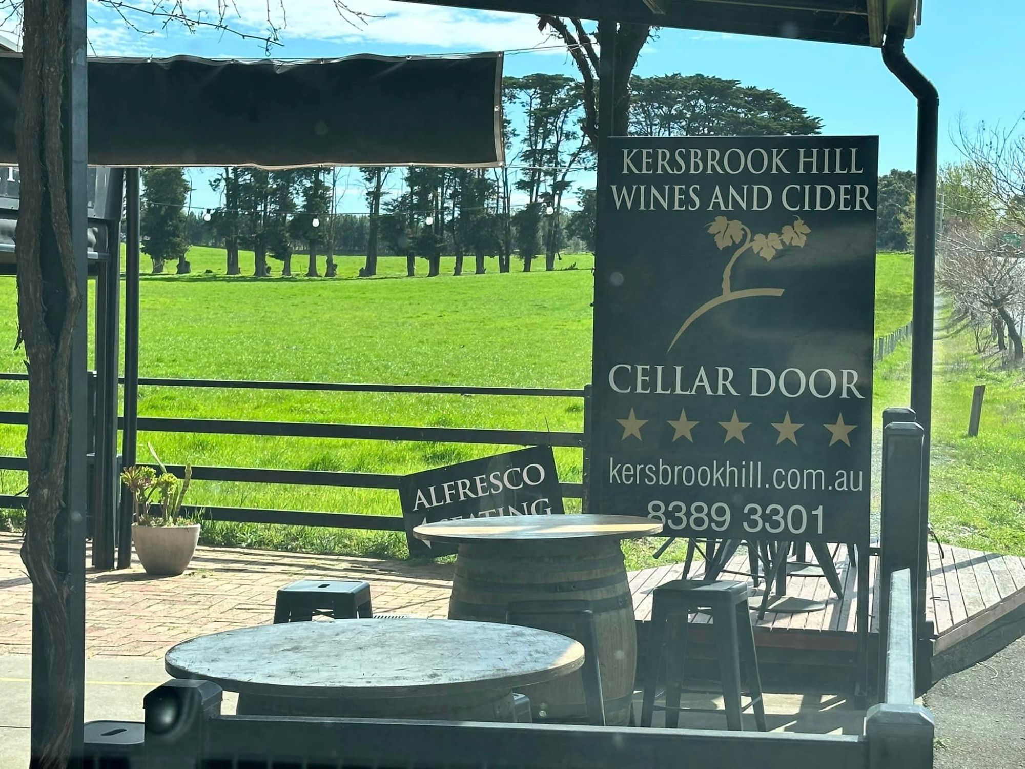 a sign on the side of a fence