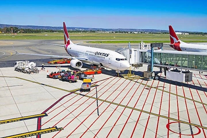 a plane sitting on the tarmac at an airport